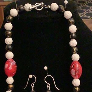 Necklace is 28 and 1/2 inches long. Earrings are 1 and 1/2 inches long.